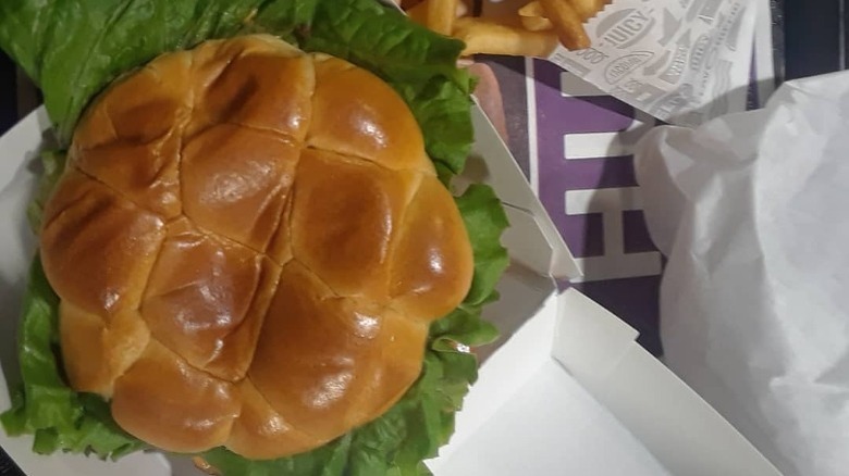 Jack in the Box Classic Buttery Jack burger on tray