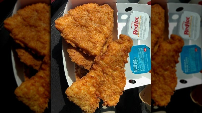 Four Jack in the Box Crispy Chicken Strips in box