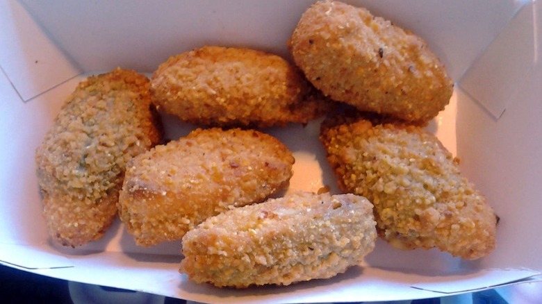 Six Jack in the Box Stuffed Jalapenos in a box