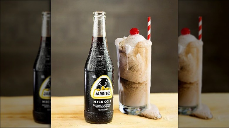 a bottle of jarritos mxcn cola with a soda float