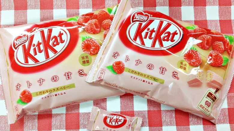 Packages of Raspberry Kit Kat on checkered tablecloth