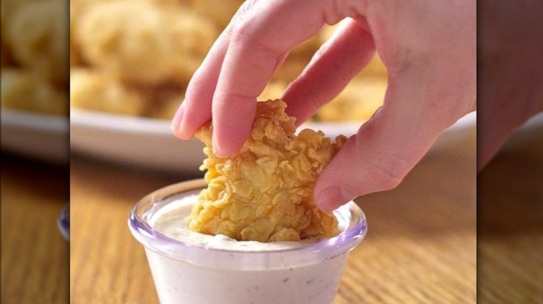 chicken tender in dunking sauce