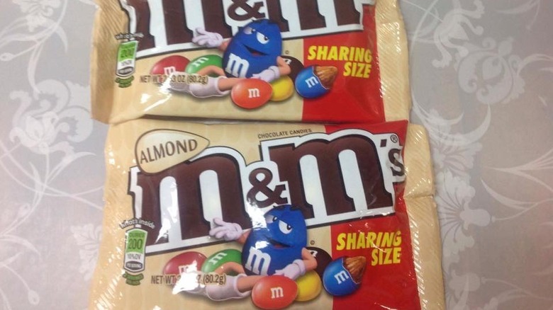 brown bags of Almond M&Ms on a table