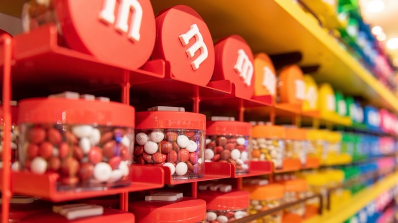 canisters of M&Ms at a store