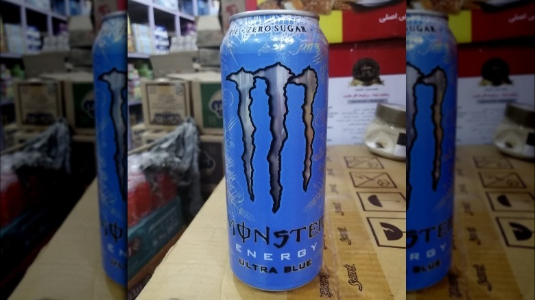 Can of Zero-Sugar Ultra Blue Monster Energy drink in warehouse