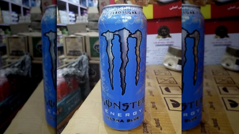 Can of Zero-Sugar Ultra Blue Monster Energy drink in warehouse