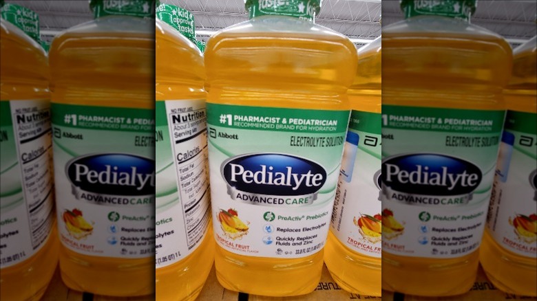 Bottles of Tropical Fruit Pedialyte AdvancedCare on store shelf