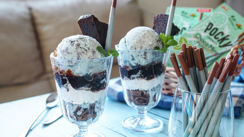 Two mint chocolate ice cream sundaes with chocomint Pocky sticks