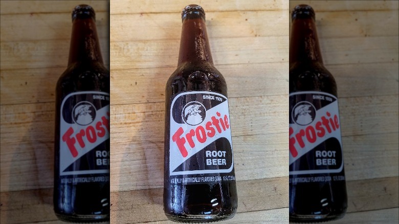 Bottle of Frostie Root Beer on wood table