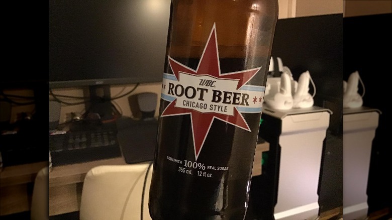 Bottle of WBC Chicago Style Root Beer in front of computer