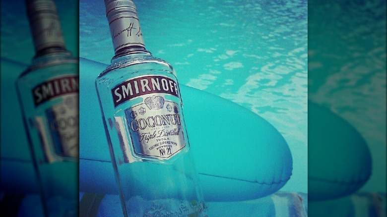 Smirnoff coconut bottle in pool 