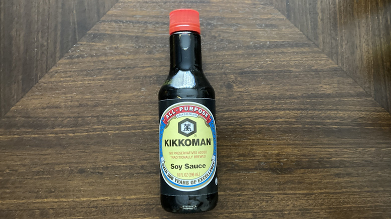 Kikkoman soy sauce bottle on table