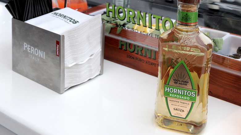 Bottle of Hornitos tequila on table