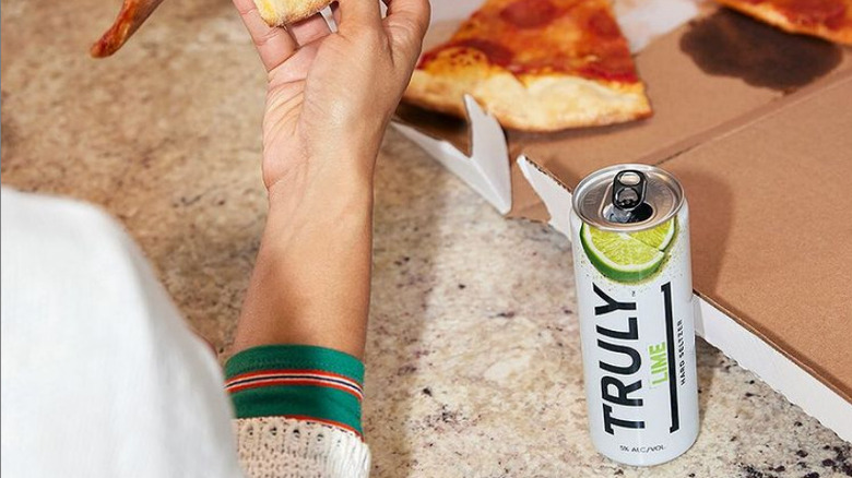 Can of Truly lime at a pizza party