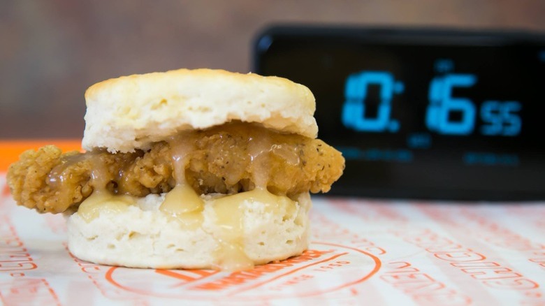 Honey Butter Chicken Biscuit next to an alarm clock