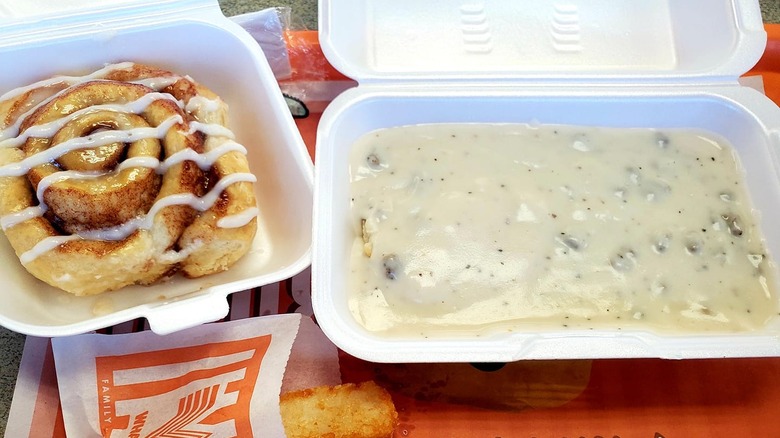 Whataburger biscuit smothered in gravy in Styrofoam container