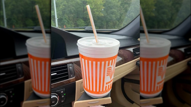 Whataburger Chocolate Shake in a car