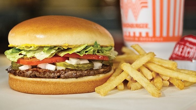 Whataburger with fries and a drink