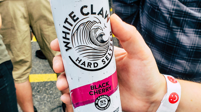 White Claw Black Cherry can in hand