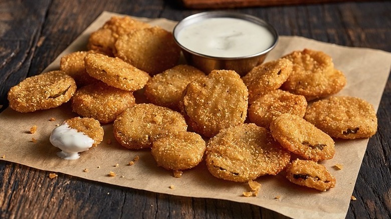 Fried Pickles on brown paper with dip