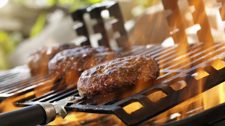 Burgers on a fiery grill