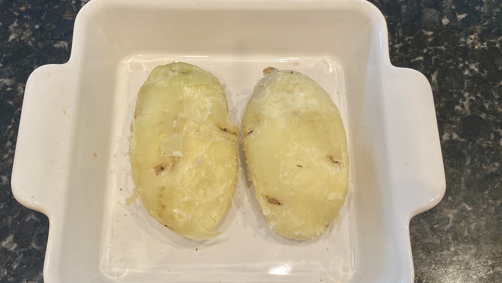cooked potatoes in white casserole dish