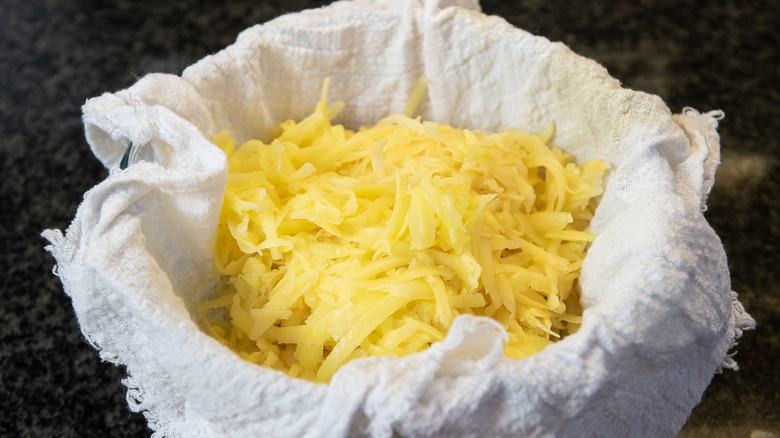 grated potatoes in cloth