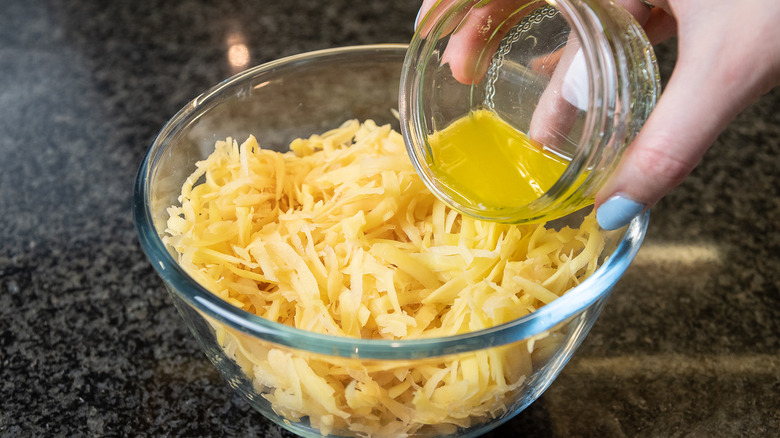 adding butter to potatoes