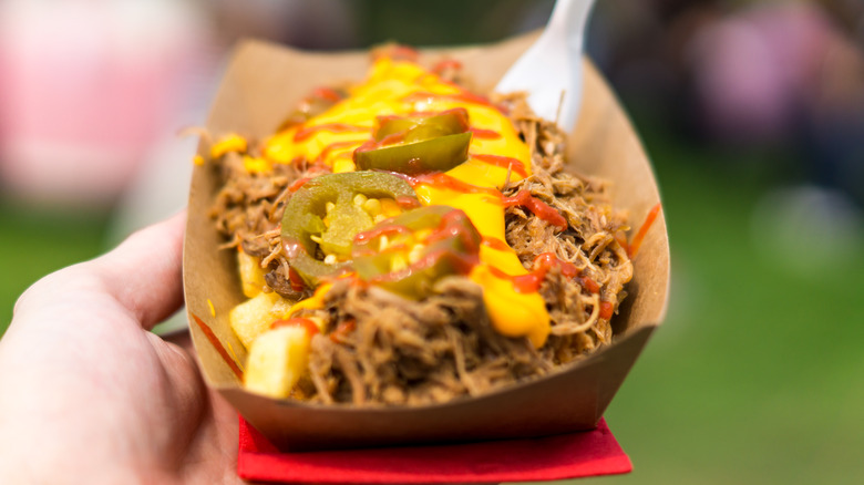 Carne asada fries with fork