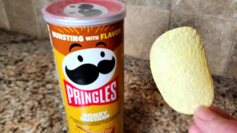 chip beside Honey Mustard Pringles can