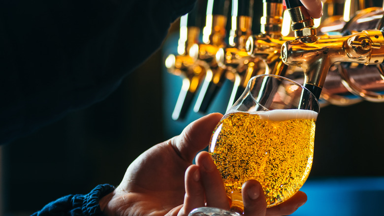 Man pouring draft beer