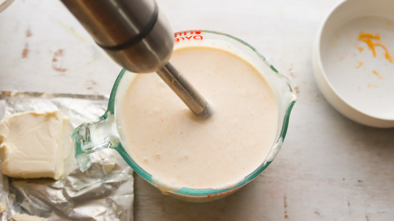 creamy mixture in measuring cup