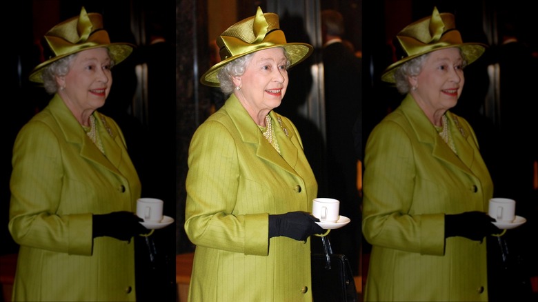 Queen Elizabeth drinking tea