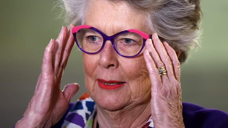 Prue Leith adjusting glasses