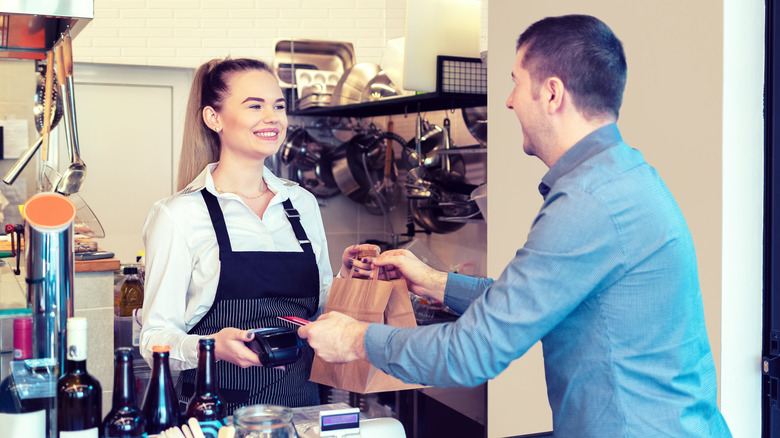 Customer and cashier interacting