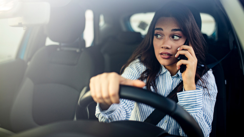 Woman in car on phone