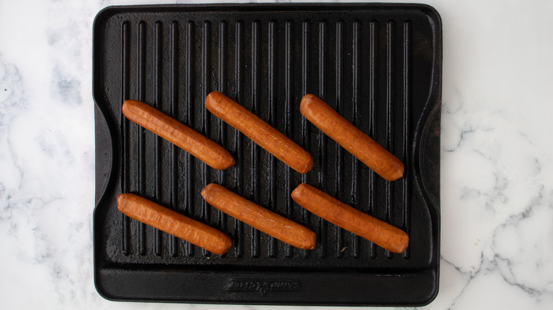 hot dogs on grill