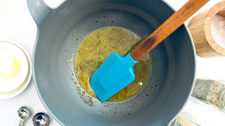 blue rubber spatula in oil