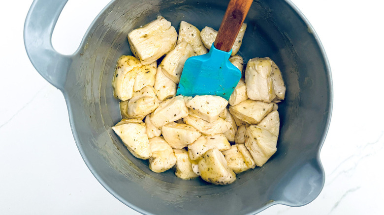 blue rubber spatula with biscuit pieces