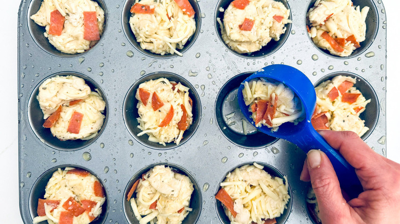 hand with biscuit muffins