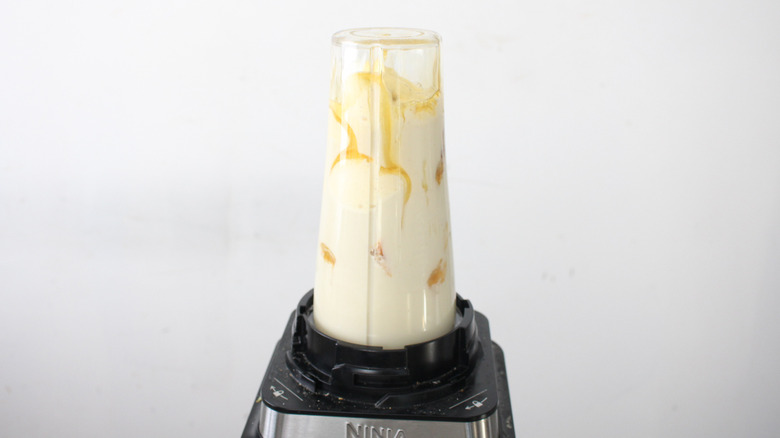 blending pumpkin pie milkshake