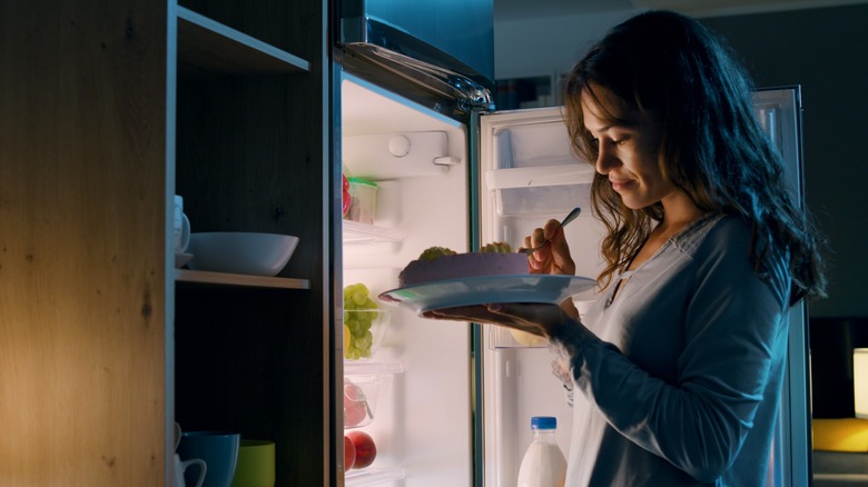 women pulling pie out of freezer 