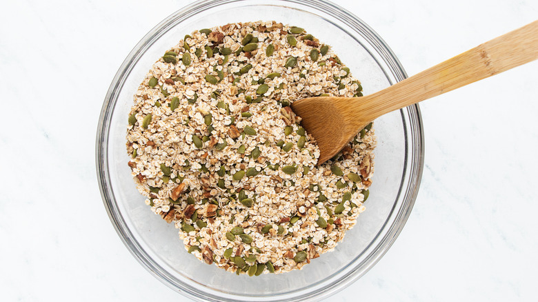 Pumpkin seeds granola dry ingredients in mixing bowl