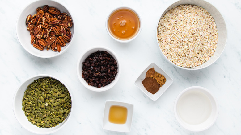 Pumpkin seed granola ingredients in bowls