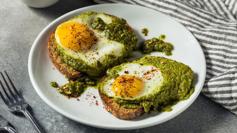 eggs cooked in pesto on toast