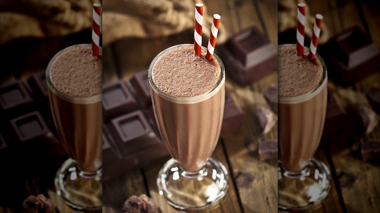 straw sticking out of chocolate milkshake