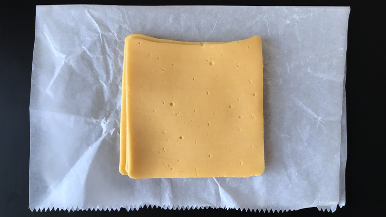 Cheese slices on cheese paper