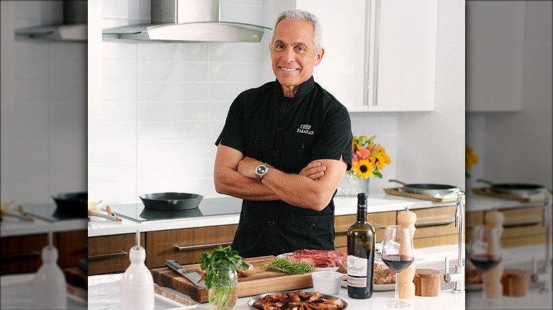 Geoffrey Zakarian standing by Harry & David products
