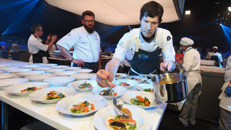 Michael Cimarusti watching someone plate