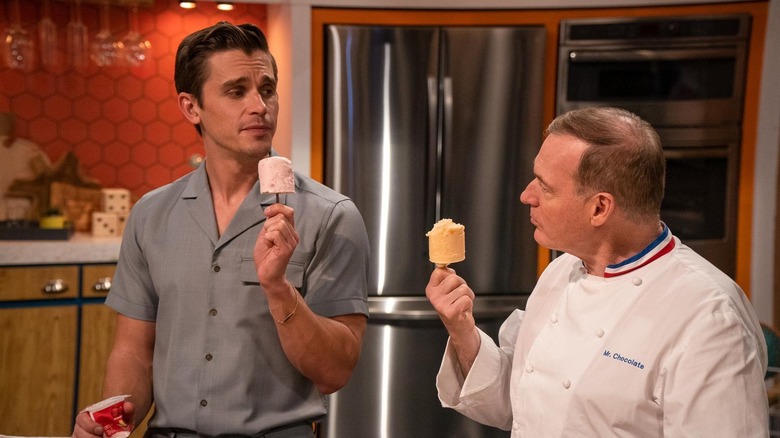 Antoni Porowski and Jacques Torres talking on set